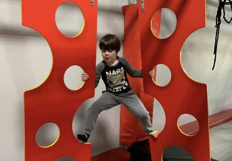 Kid climbing wall obstacle