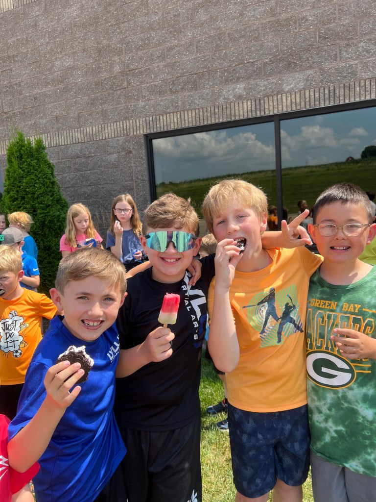 Summer camp kids with popsicles